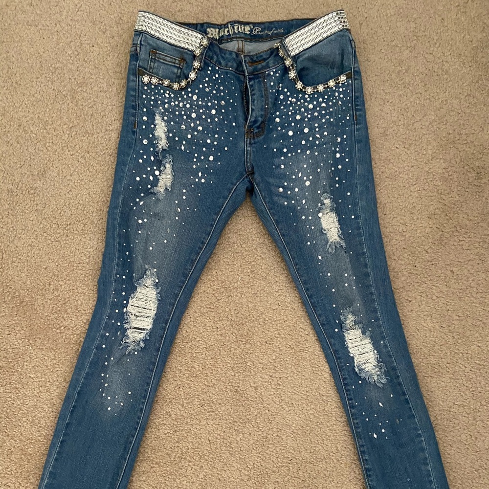 Distressed light wash embellished jeans